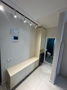 a room with a kitchen with a counter and a microwave at Kobuleti One in K'obulet'i