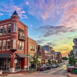 a city street at sunset with cars parked on the street at Providence Place in Clarksville