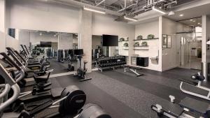 a gym with a lot of cardio equipment in it at Luxury 1bedroom 1bath w Deck Gaslamp Quarter in San Diego