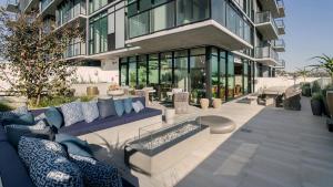 a building with a blue couch in front of it at Luxury 1bedroom 1bath w Deck Gaslamp Quarter in San Diego