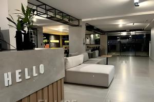a hotel lobby with a white couch and a table at #FLAT425 Get One - João Pessoa - Brasil in João Pessoa +53 photos