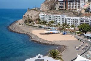 an aerial view of a hotel and a beach at Vista Oceano Luxury Suite in Mogán