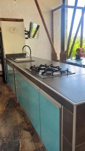 a kitchen with a stove and a counter top at Casa quinta con psicina in Estación El Salto