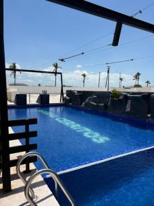 Bazén v ubytování CC Condominio nebo v jeho okolí + 1 fotografie