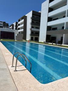 Bazén v ubytování CC Condominio nebo v jeho okolí