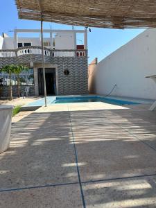 a house with a swimming pool and a building at Villa De Compagne  +15 photos