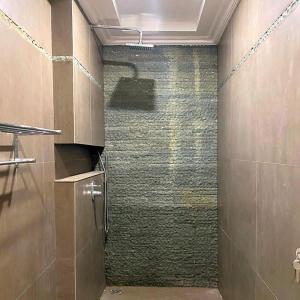 a bathroom with a shower with a glass wall at The PD in Amed +27 photos