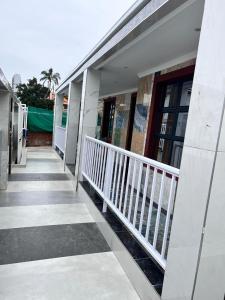 a hallway of a building with a white railing at Marble inn accommodation in Durban +1 photo