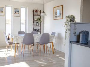 a dining room with a table and chairs at 6 person holiday home in Vestervig in Vestervig