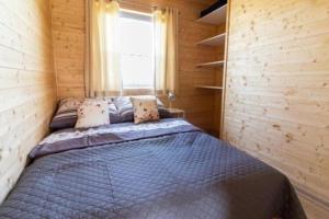 Ένα ή περισσότερα κρεβάτια σε δωμάτιο στο Comfortable holiday homes in Mielno