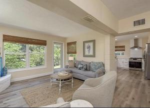 a living room with a couch and a table at Retreat on the Bayou in Port Richey