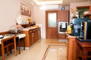 Kuchyňa alebo kuchynka v ubytovaní Penzion Astra