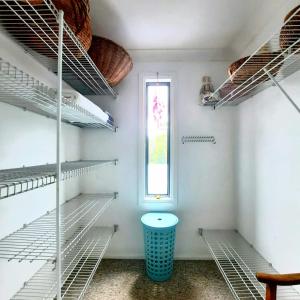 a room with empty shelves and a window at Misty River in Macksville +14 photos