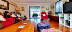 a living room with a couch and a table at Misty River in Macksville