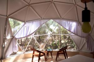 Postel nebo postele na pokoji v ubytování Glamping Mayan Glam