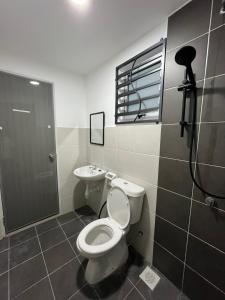 a bathroom with a toilet and a sink at Landed KLIA Netflix, Fully AC&Heater, Kids Pool in Sepang