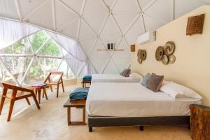 Postel nebo postele na pokoji v ubytování Glamping Mayan Glam