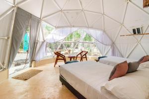 Postel nebo postele na pokoji v ubytování Glamping Mayan Glam