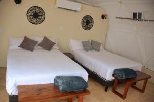 Postel nebo postele na pokoji v ubytování Glamping Mayan Glam