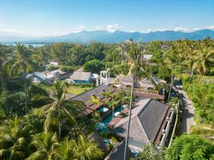 an aerial view of a resort with palm trees at Villa Tahid in Gili Islands