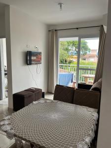 TV a/nebo společenská místnost v ubytování Espaço aconchegante e familiar