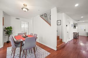 a dining room with a red table and chairs at Dazzling 4BR Near Amazon Studios Venice Beach in Los Angeles