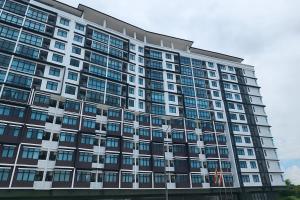 a large building with many windows at d 'ATHIF Homestay Samarahan 2 in Kuching