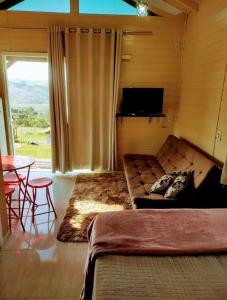 Ruang duduk di Sitio Berebello cabana padrão