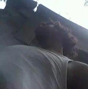 a woman laying on a bed with her head in at Yeiko in Carlos Guerra