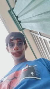 a statue of a baseball player wearing a uniform at Yeiko in Carlos Guerra