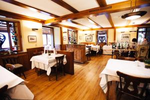 a restaurant with tables and chairs in a room at Hotel Adler Bärental in Feldberg +45 photos