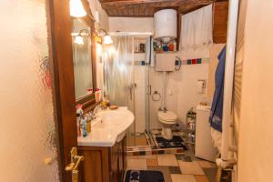a small bathroom with a sink and a toilet at Rozina Vacation House in Pliskovica +40 photos