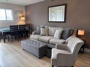 a living room with a couch and a table at Resort Condo for 6 with Tons of Amenities Near Beach in Hilton Head Island