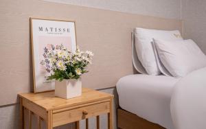 Postel nebo postele na pokoji v ubytování Peanut Hotel Myeongdong