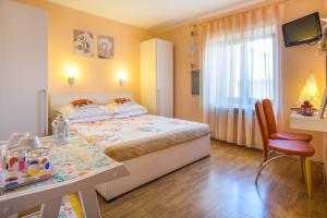 Postel nebo postele na pokoji v ubytování Apartments & Rooms Iva