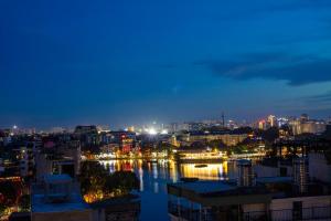 a view of a city at night at Azen Lakeside Hotel & Travel in Hanoi