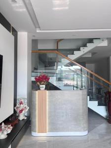 a staircase in a house with a lobby at Emirlan Homestay in Hue