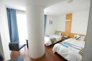 Tempat tidur dalam kamar di Hotel Flex