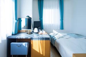 Tempat tidur dalam kamar di Hotel Flex