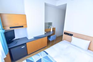 Tempat tidur dalam kamar di Hotel Flex