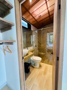 a bathroom with a toilet and a sink at La Capilla EcoHotel in Moniquirá +44 photos