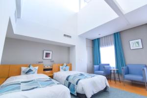Tempat tidur dalam kamar di Hotel Flex