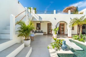 a villa with a swimming pool and a patio at Noa Villa Gili Air in Gili Islands