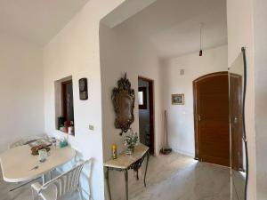 a room with a table and a mirror on the wall at Marina5,North coast, Unique chalet 2 beautiful comfy homes Family only in El Alamein