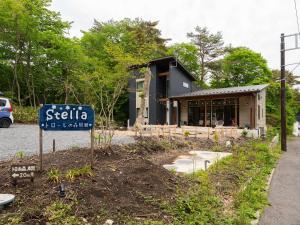 a building with a sign in front of it at TrollForestStella in Nikko