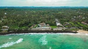 an aerial view of a beach and the ocean at Marshmallow Bay Boutique Hotel & Surf Point Adults Only in Ahangama