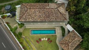 an overhead view of a house with a swimming pool at Marshmallow Bay Boutique Hotel & Surf Point Adults Only in Ahangama