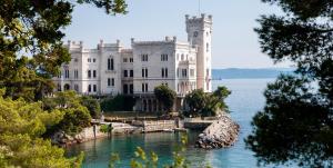 a castle in the middle of a body of water at Rozina Vacation House in Pliskovica