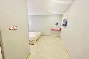 Postel nebo postele na pokoji v ubytování Hotel Dlima Inn Bukit Bintang