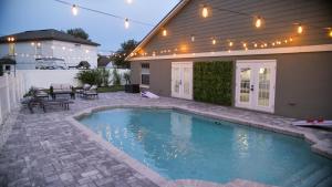 a swimming pool in the backyard of a house at Luxury home with Pool & 6 Beds near Disney in Kissimmee